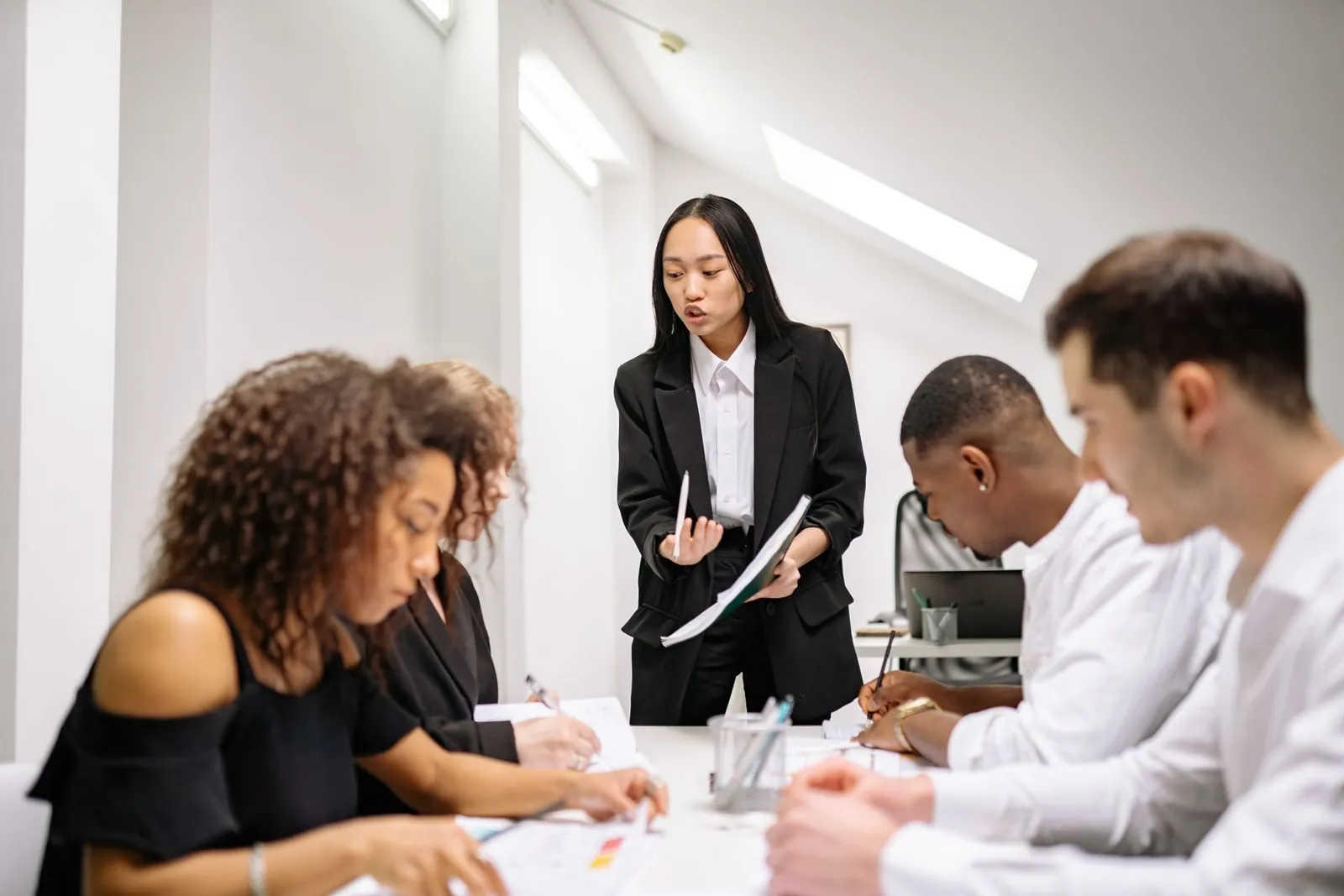 Professionals reviewing tax filing documents together at a table