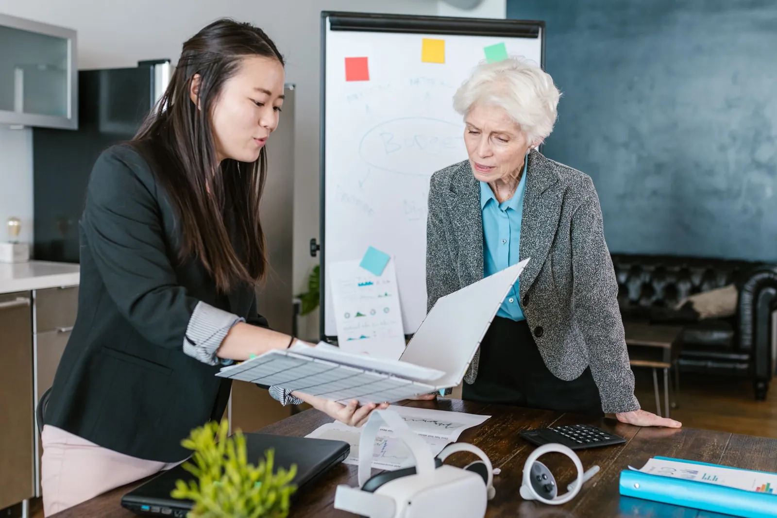Advisor and business owner reviewing options at a whiteboard